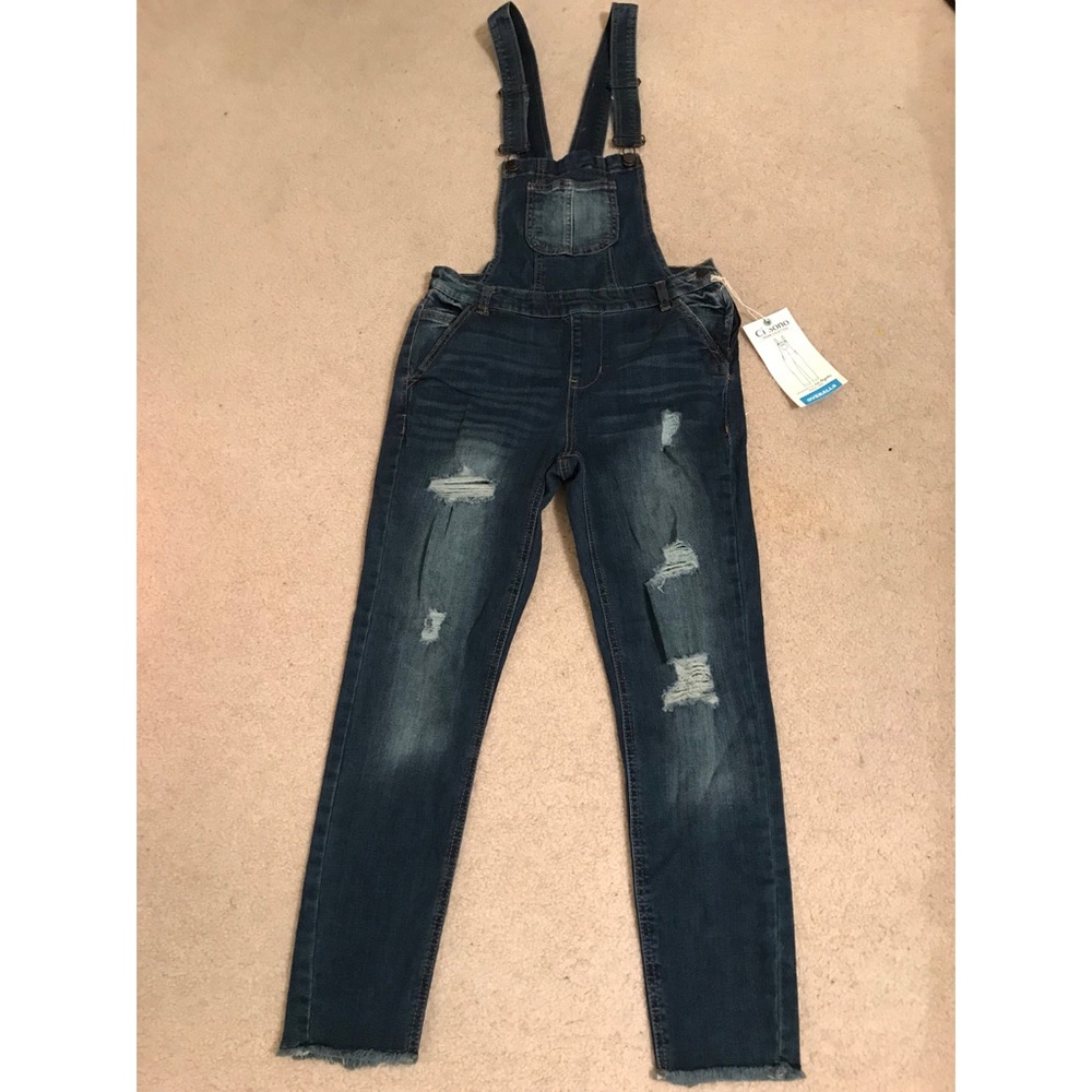 Never worn before stylish ripped denim overalls.